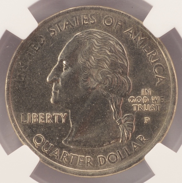 2006-D Colorado quarter with missing clad layer showing exposed copper core on one face